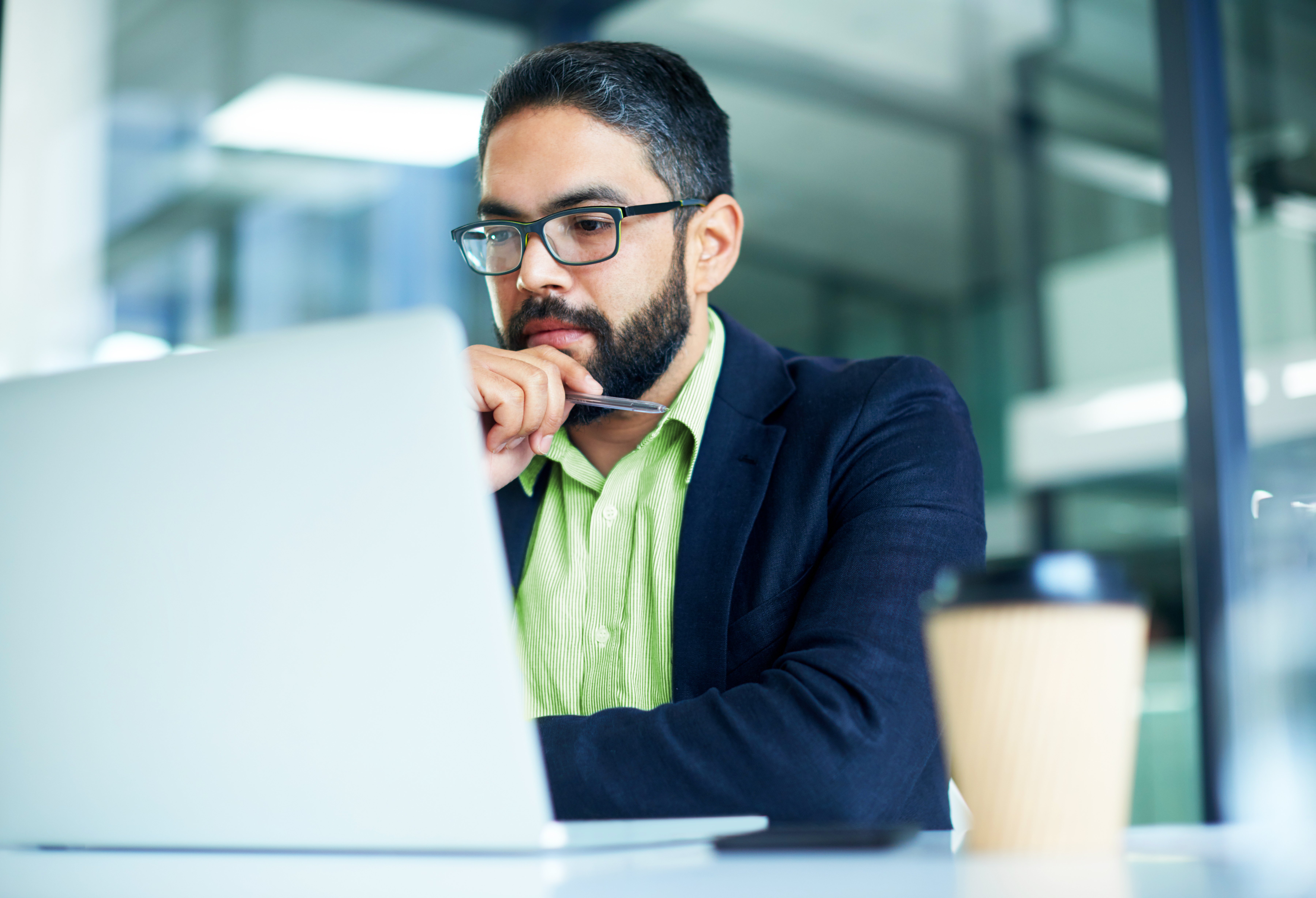 Shot of a mature businessman working on a laptop in an office